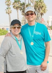Dr. Granzow Posing With Kathy Bates at LERN Walk Wearing Race Medals